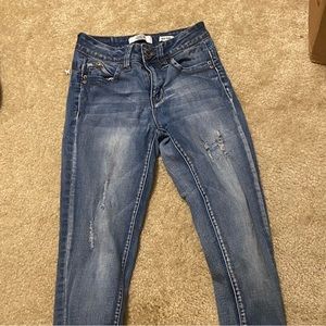 Light blue jeans, with holes